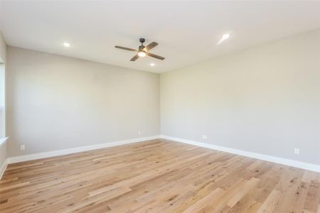 Empty room featuring light hardwood / wood-style floors and ceiling fan