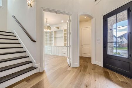 Foyer entrance featuring light hardwood / wood-style floors