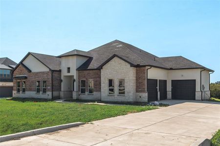 View of front facade with a front lawn and a garage