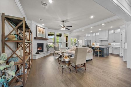 Cozy fireplace accents living room and open kitchen area!