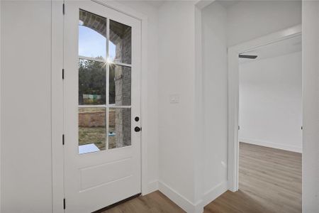 Entryway featuring light wood-type flooring.