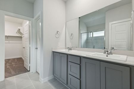 Primary Bathroom in the Oscar home plan by Trophy Signature Homes – REPRESENTATIVE PHOTO