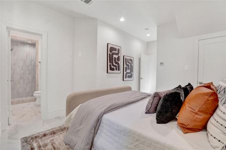 *Photos are from 5435 Darling* En-suite bedroom on the first floor with a specious under-stairs storage space. This bedroom is ideal for your home office, in-laws bedroom, or a guest bedroom.