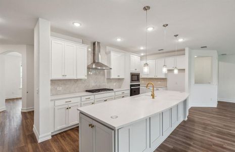 Bright kitchen with oversized island *real home pictured