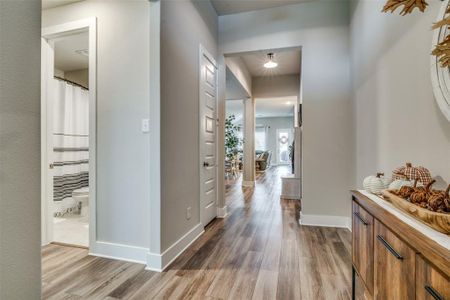 Hall featuring light hardwood / wood-style flooring