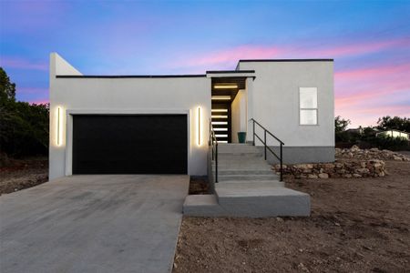 Gorgeous modern design on a corner lot in highly desirable Lago Vista location just minutes from Lake Travis! State-of-the art construction with structural concrete insulated panels (SCIP0.