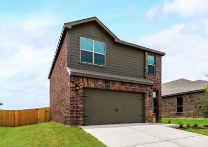 This home has a luxurious brick exterior paired with dark gray siding.