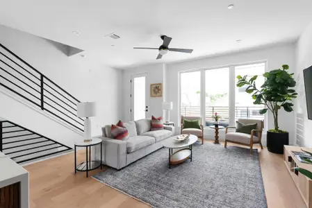 Abundant natural light in open & airy space with balconies on both upper levels