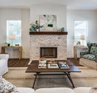 Living room featuring a fireplace and dark hardwood / wood-style floors