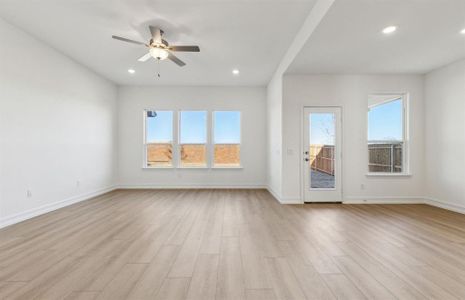 Bright gathering room with large windows *real home pictured