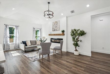 Living room with plenty of natural light and electric fireplace