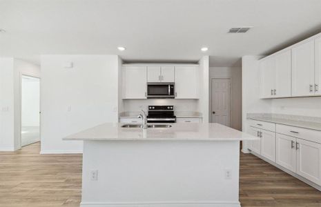 Bright kitchen with ample cabinet space *real home pictured