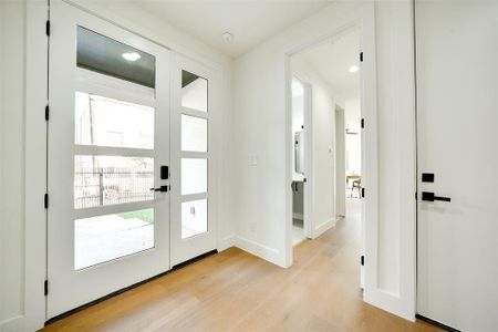 Doorway to outside featuring light wood-type flooring