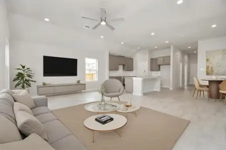 Bring your loved ones and guests together in the inviting living room! Boasting lofty high ceilings, recessed lighting, a stylish ceiling fan, custom paint, stunning flooring, and expansive windows that flood the space with ample natural light all day long. Virtually staged.