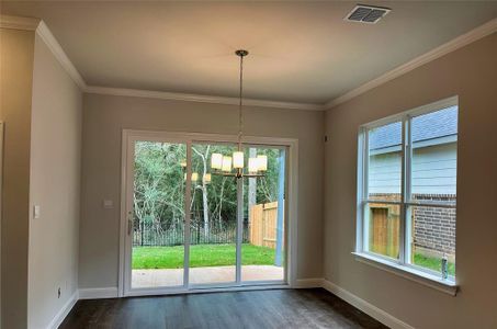 Enjoy your dinners staring out your multi-slide door into the woods behind your property!