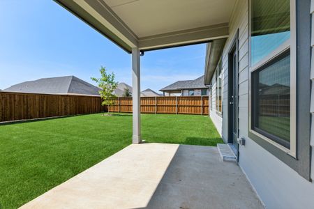 Covered Patio in the Masters home plan by Trophy Signature Homes – REPRESENTATIVE PHOTO