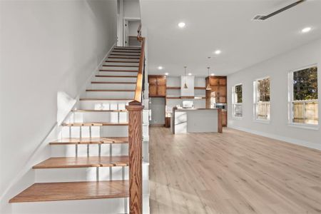 Stairway with hardwood / wood-style flooring