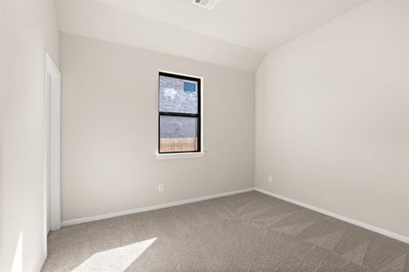 Your secondary bedroom features plush carpet, fresh paint, closet, and a large window that lets in plenty of natural lighting.