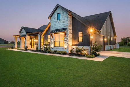 Modern farmhouse style home featuring a yard