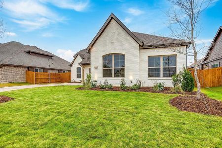 View of front of property with a front lawn