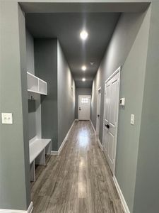 Hallway with wood-type flooring