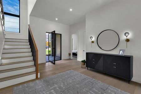 Entryway with a wealth of natural light and light wood-type flooring