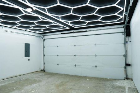 Garage featuring electric panel