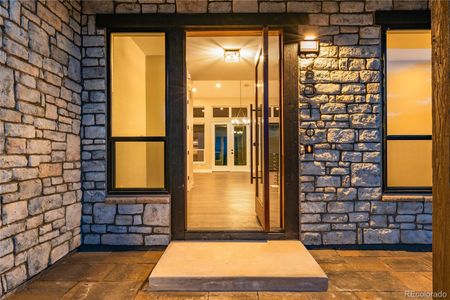 Striking stone work draws you into the inviting foyer.