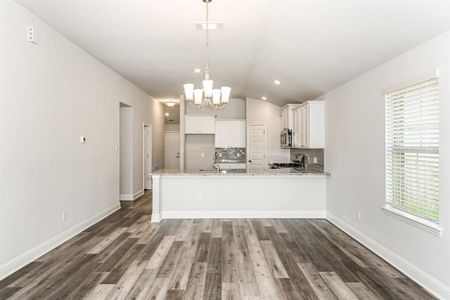 The Kitchen with an eat in counter *Stock Photo- Colors and features may vary from actual home