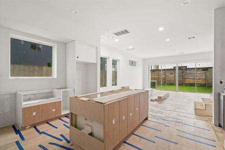 First floor kitchen and living space with engineered white oak flooring throughout