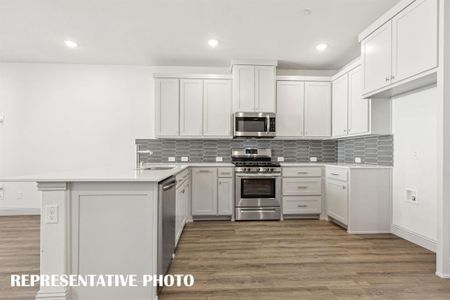 Beautiful finishes paired with a neutral color palette make our Hampton plan kitchen stand out from the crowd!  REPRESENTATIVE PHOTO