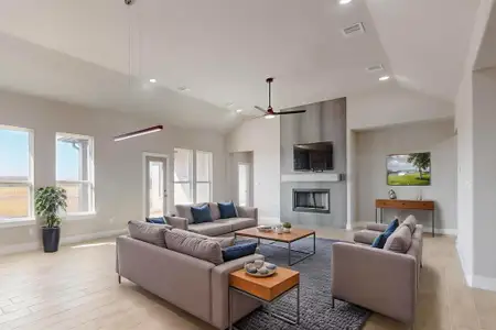 Living area with recessed lighting, light wood-type flooring, a large fireplace, and visible vents