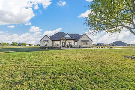 View of front of property with a front lawn