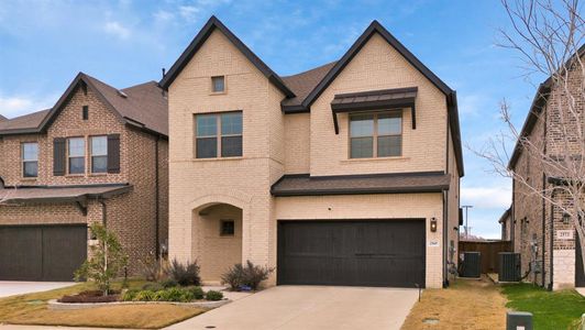 The front facade showing a garage and lawn