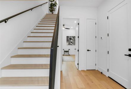 COAT CLOSET AND ENTRY TO 1ST FLOOR BEDROOM AND GARAGE