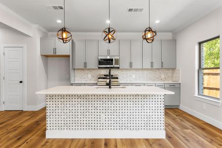 Unfurnished room with ceiling fan, carpet flooring, a tray ceiling, and ornamental molding