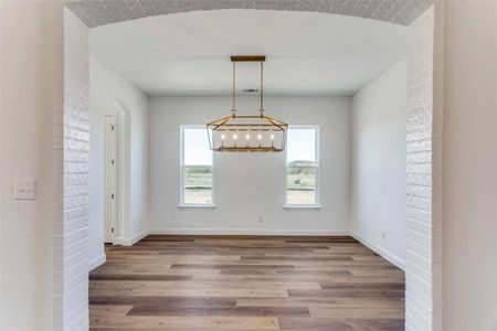 Unfurnished dining area with light hardwood / wood-style floors