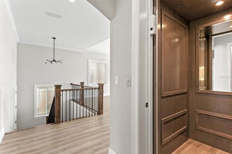 Private elevator to first level Garage; stairs to front entry door and Garage.