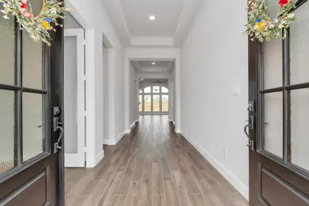 Double doors lead to a grand entrance with 12 ft ceilings!