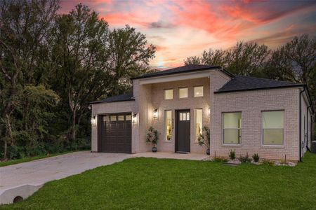 View of front of property with a yard