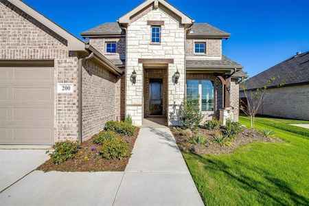 View of front facade with a front lawn and a garage