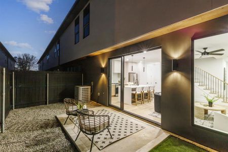 Private patio with turf and 6' privacy fence