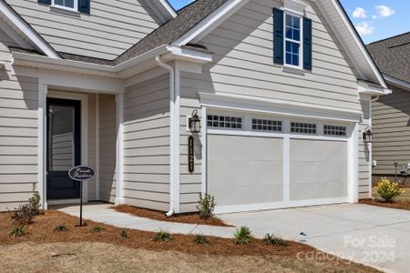 Low maintenance fiber cement siding and a garage with a 4' extension.