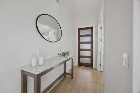 Entryway featuring light  finished luxury vinyl floors.