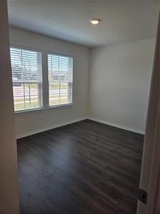 Spare room with hardwood / wood-style flooring