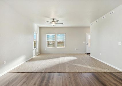 The family room has a ceiling fan.