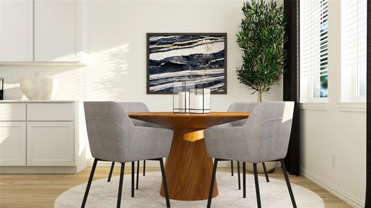 Dining area with light hardwood / wood-style flooring