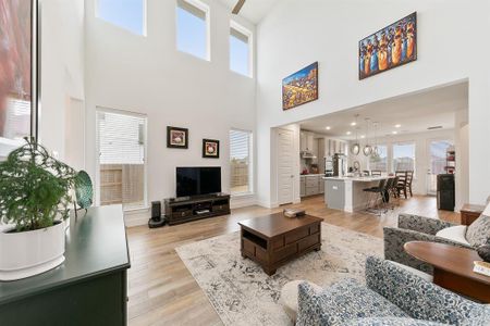 Living room with soaring ceilings, creating an open and airy atmosphere