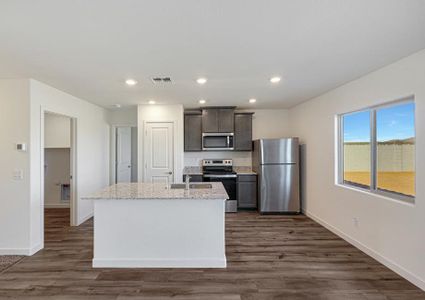 This kitchen has a beautiful granite island.