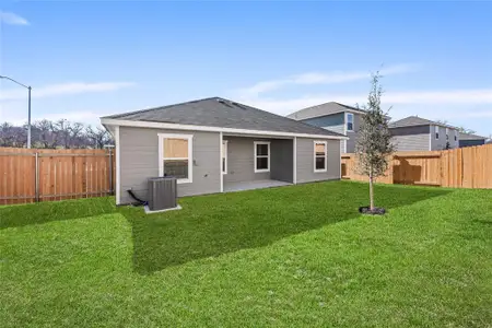 Back of property with central AC, a patio area, and a shingled roof Back of property with central AC, a patio area, and a shingled roof
